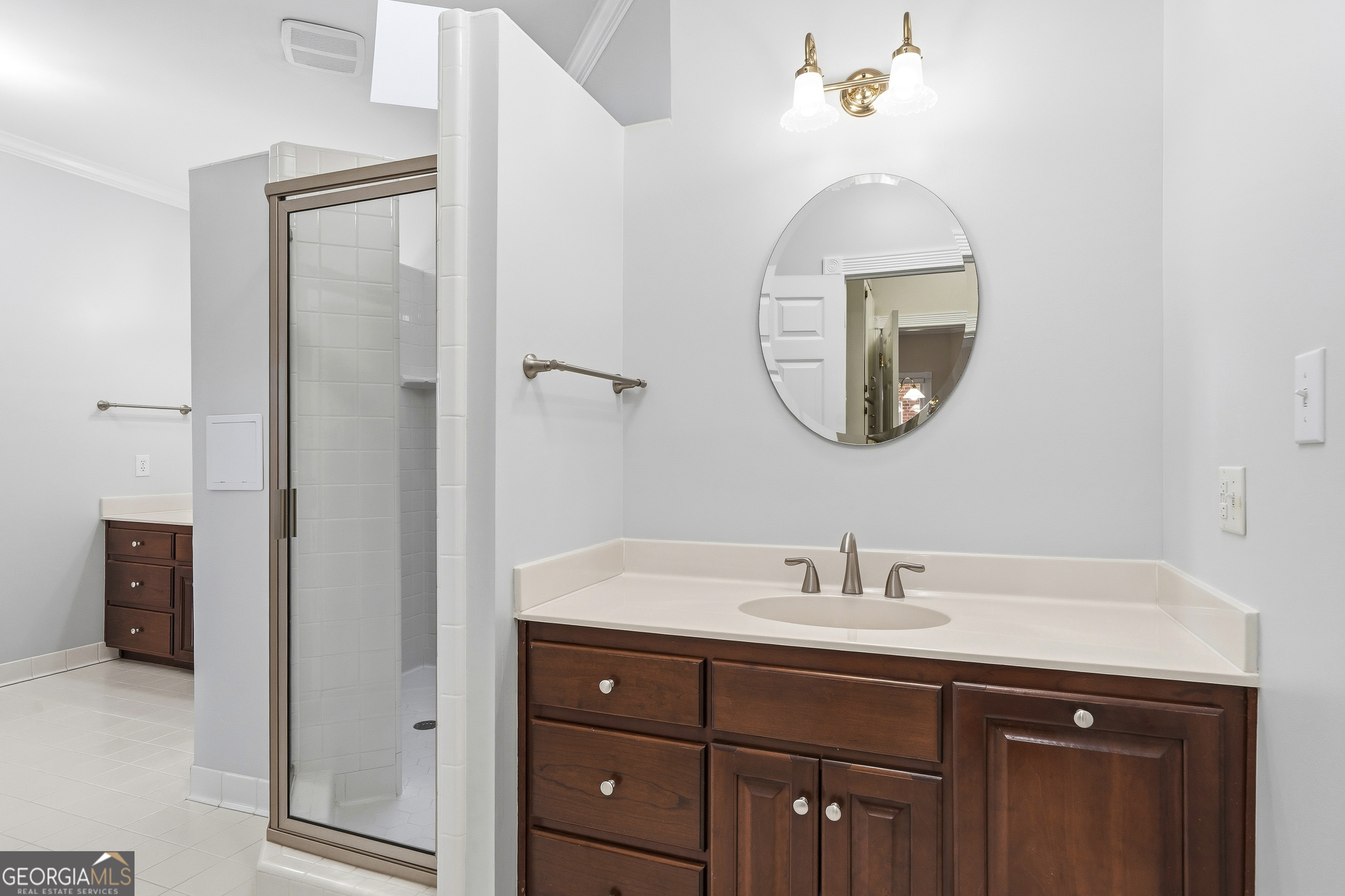 104 Spruce Point Southeast Eatonton, GA 31024 - Photo 27 of 63 a bathroom with a sink and a mirror