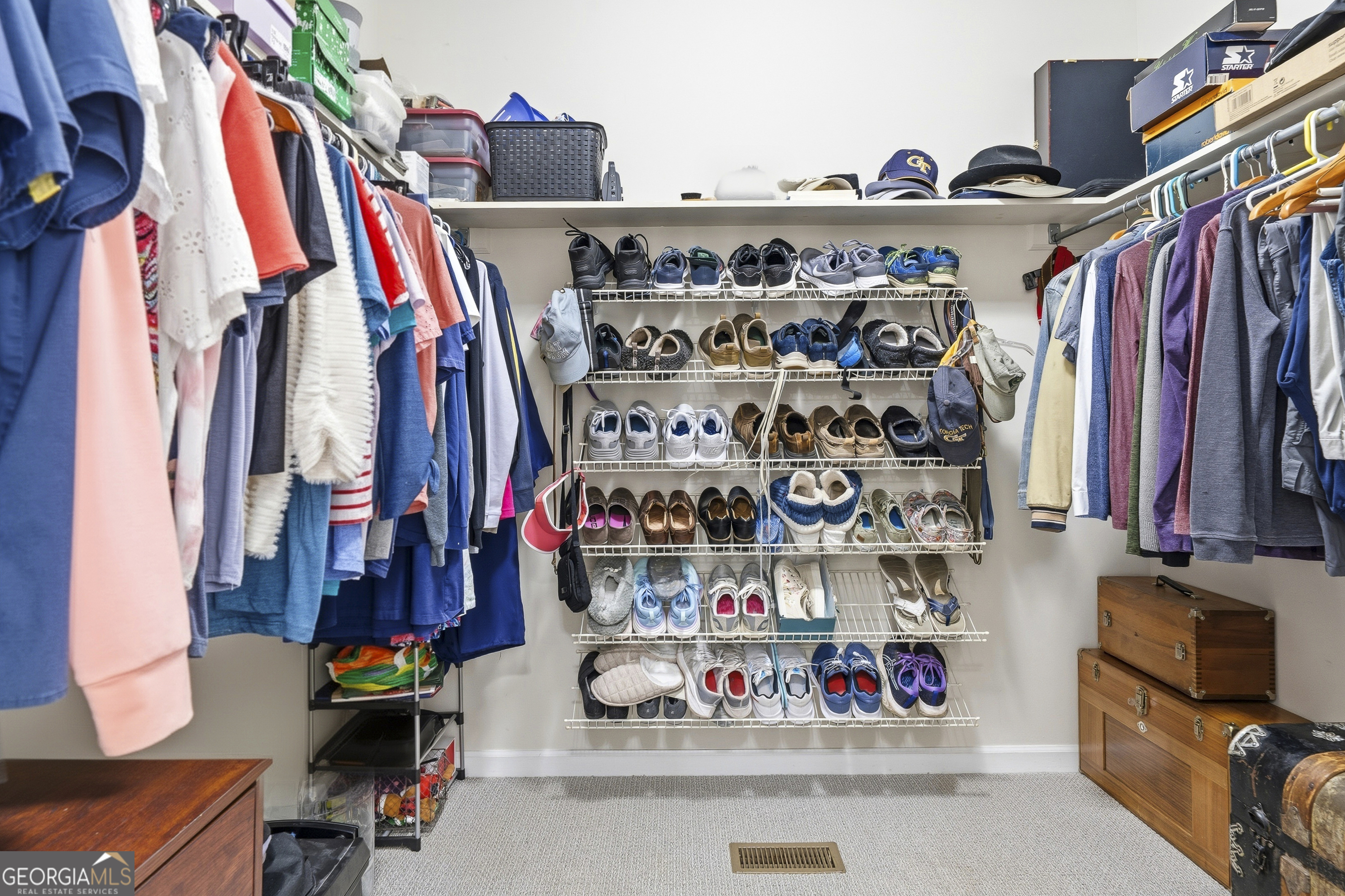104 Spruce Point Southeast Eatonton, GA 31024 - Photo 28 of 63 a view of walk in closet with clothes and shoes