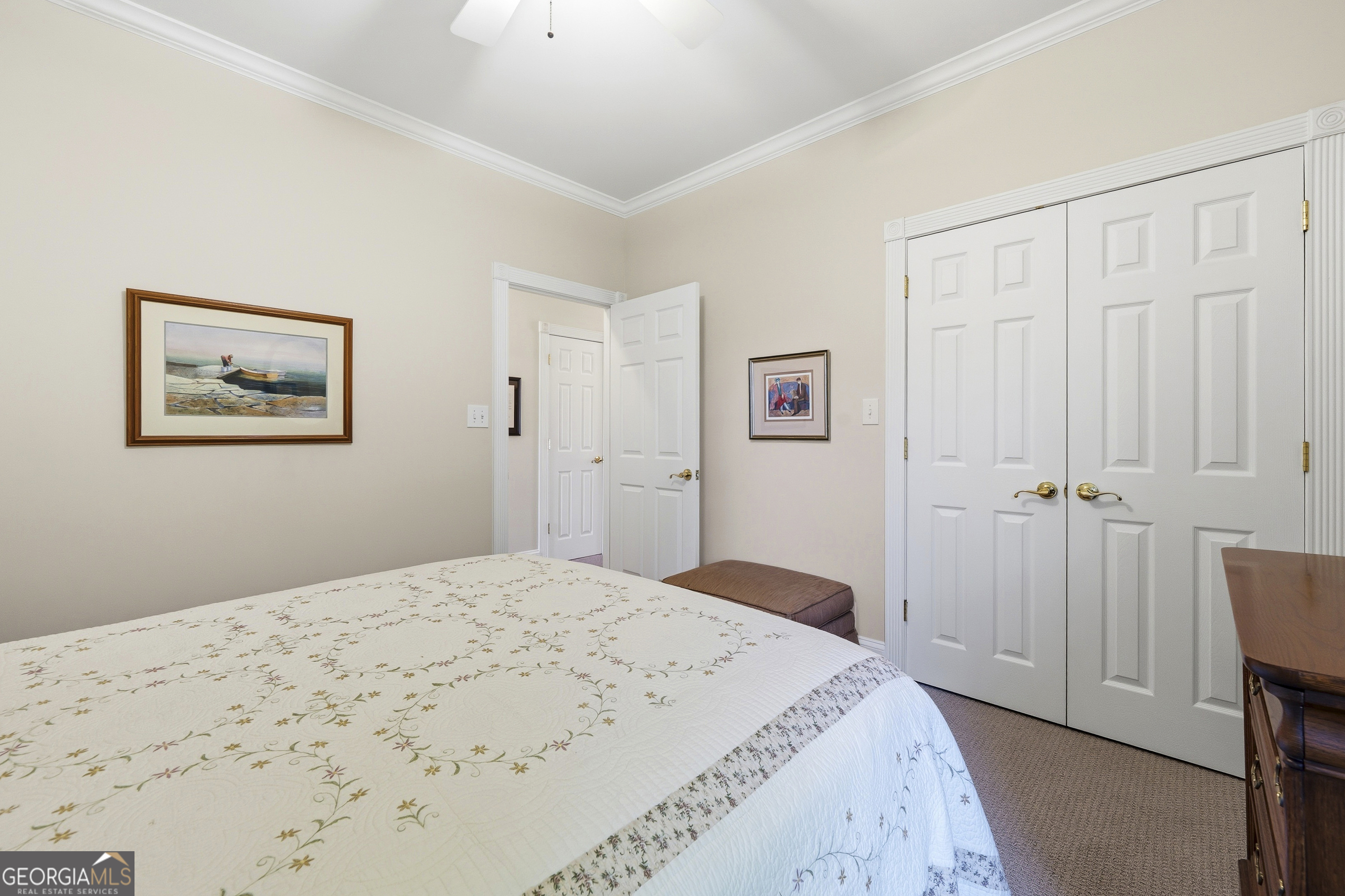 104 Spruce Point Southeast Eatonton, GA 31024 - Photo 34 of 63 a bedroom with a bed and a closet