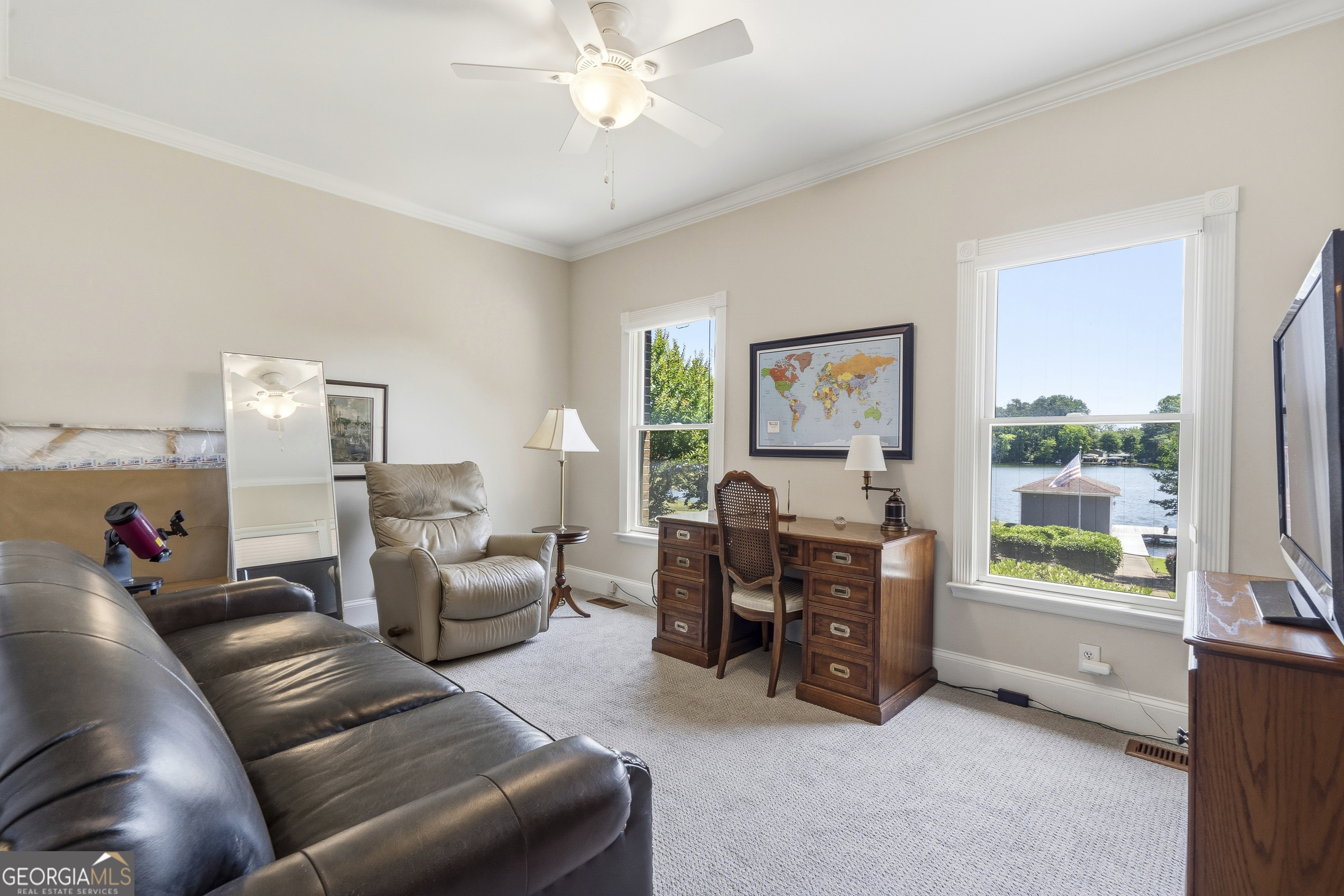 104 Spruce Point Southeast Eatonton, GA 31024 - Photo 35 of 63 a living room with furniture and a large window