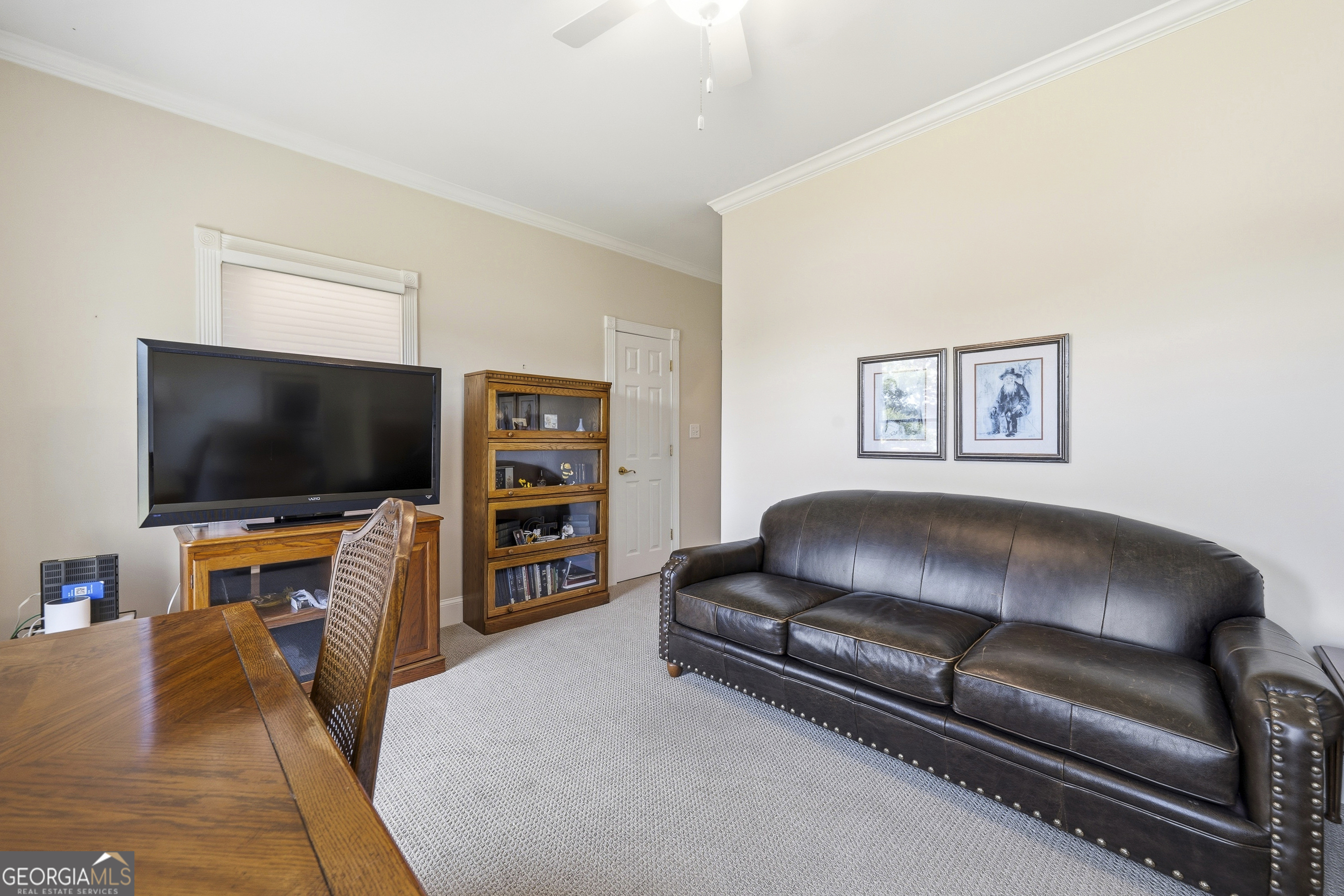 104 Spruce Point Southeast Eatonton, GA 31024 - Photo 36 of 63 a living room with furniture and a flat screen tv