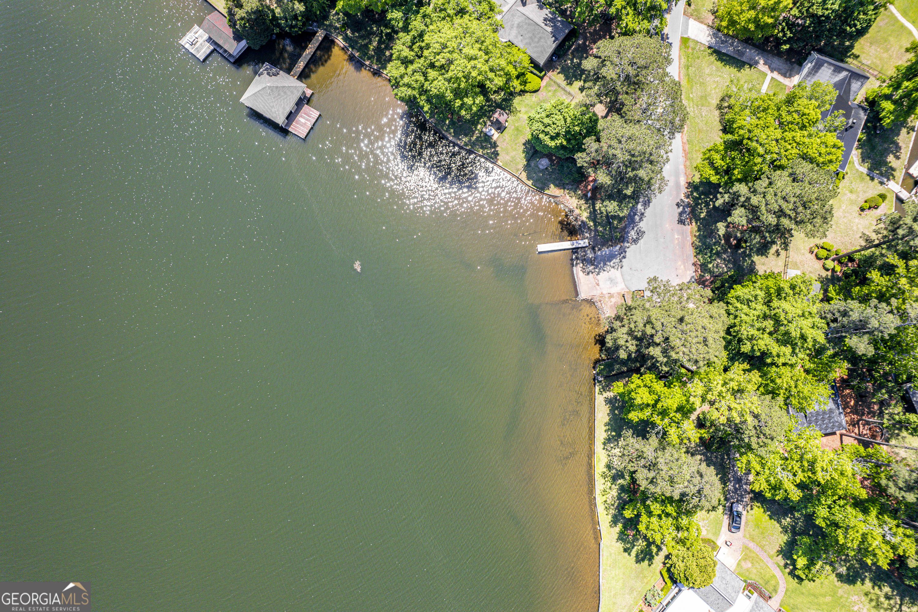 104 Spruce Point Southeast Eatonton, GA 31024 - Photo 44 of 63 an aerial view of a house with a yard and lake view