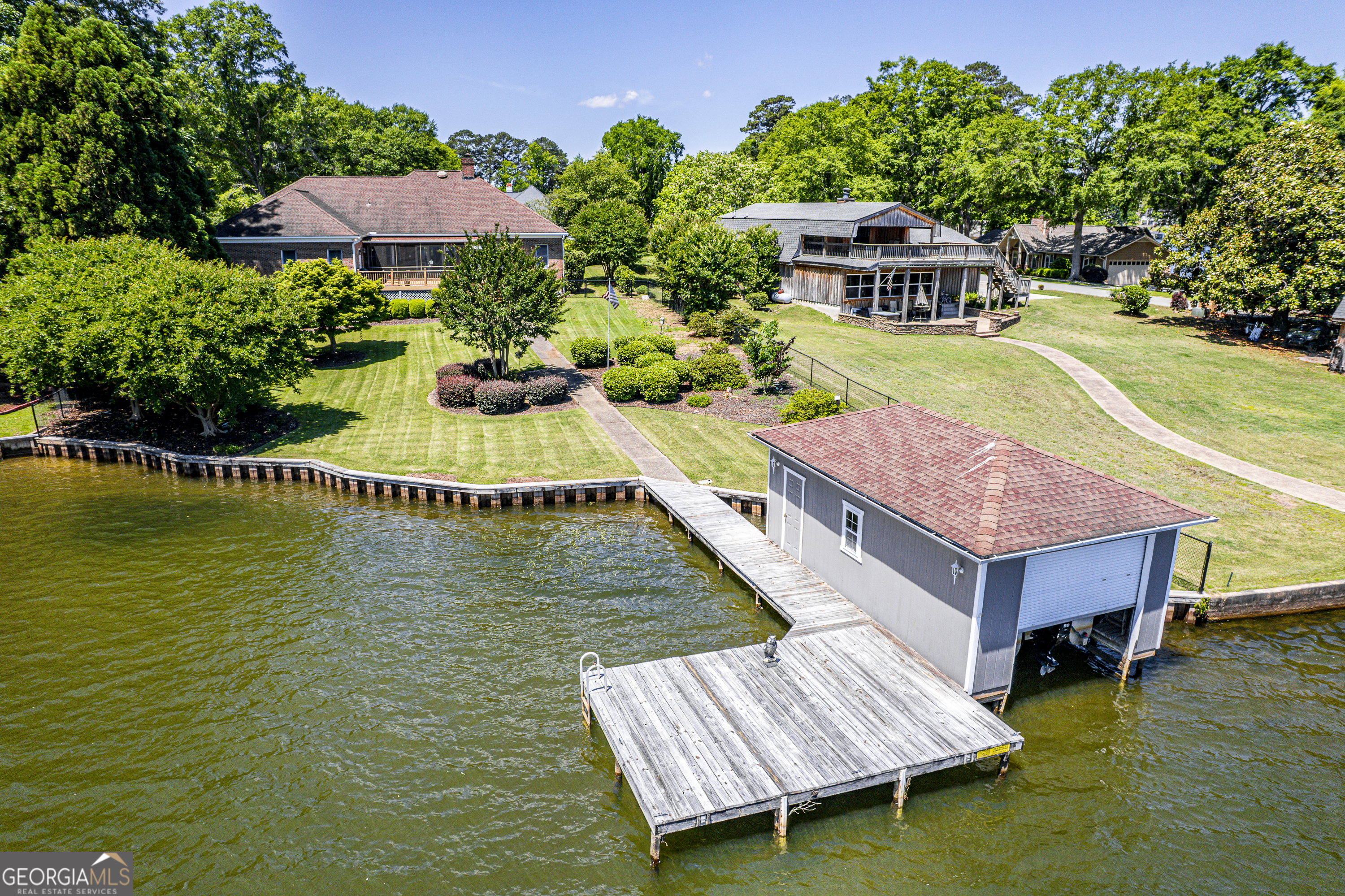 104 Spruce Point Southeast Eatonton, GA 31024 - Photo 47 of 63 a view of house with garden space and swimming pool