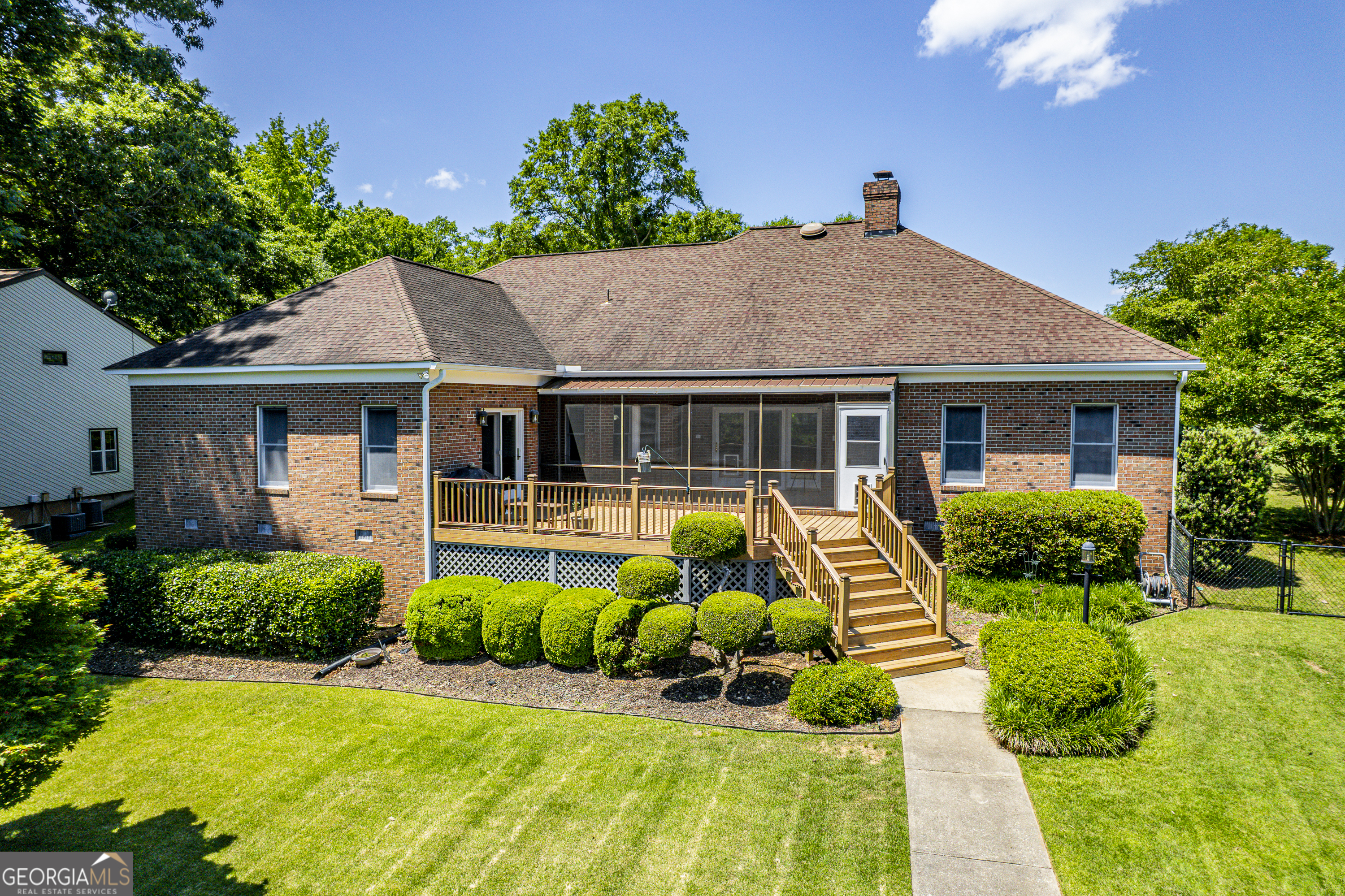 104 Spruce Point Southeast Eatonton, GA 31024 - Photo 48 of 63 a front view of a house with a garden and plants