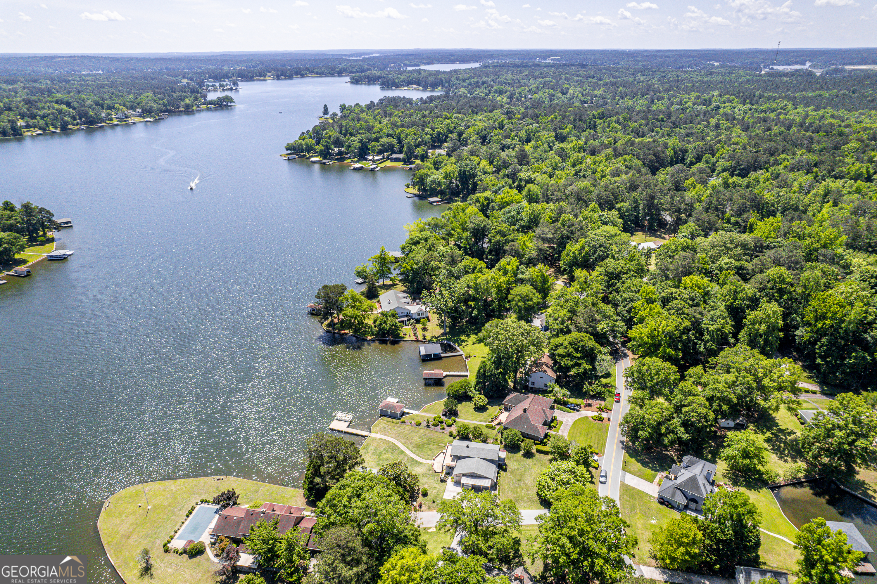 104 Spruce Point Southeast Eatonton, GA 31024 - Photo 61 of 63 a view of a lake with a large mountain view