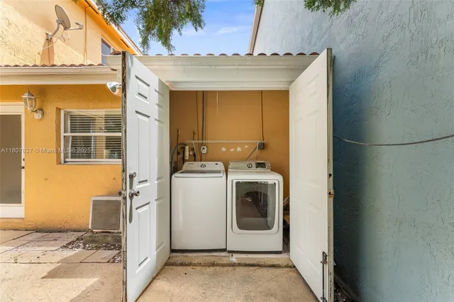 a utility room with dryer and washer