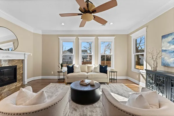 a living room with furniture and a fireplace