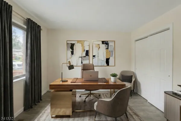 a dining room with furniture and wooden floor