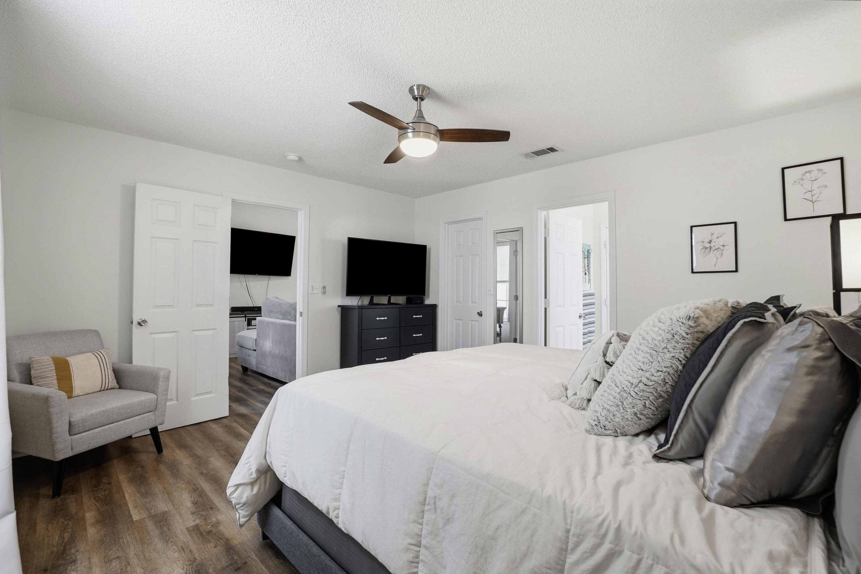 91 Oakridge Way DeFuniak Springs, FL 32433 - Photo 11 of 25 a bedroom with a bed and a flat screen tv
