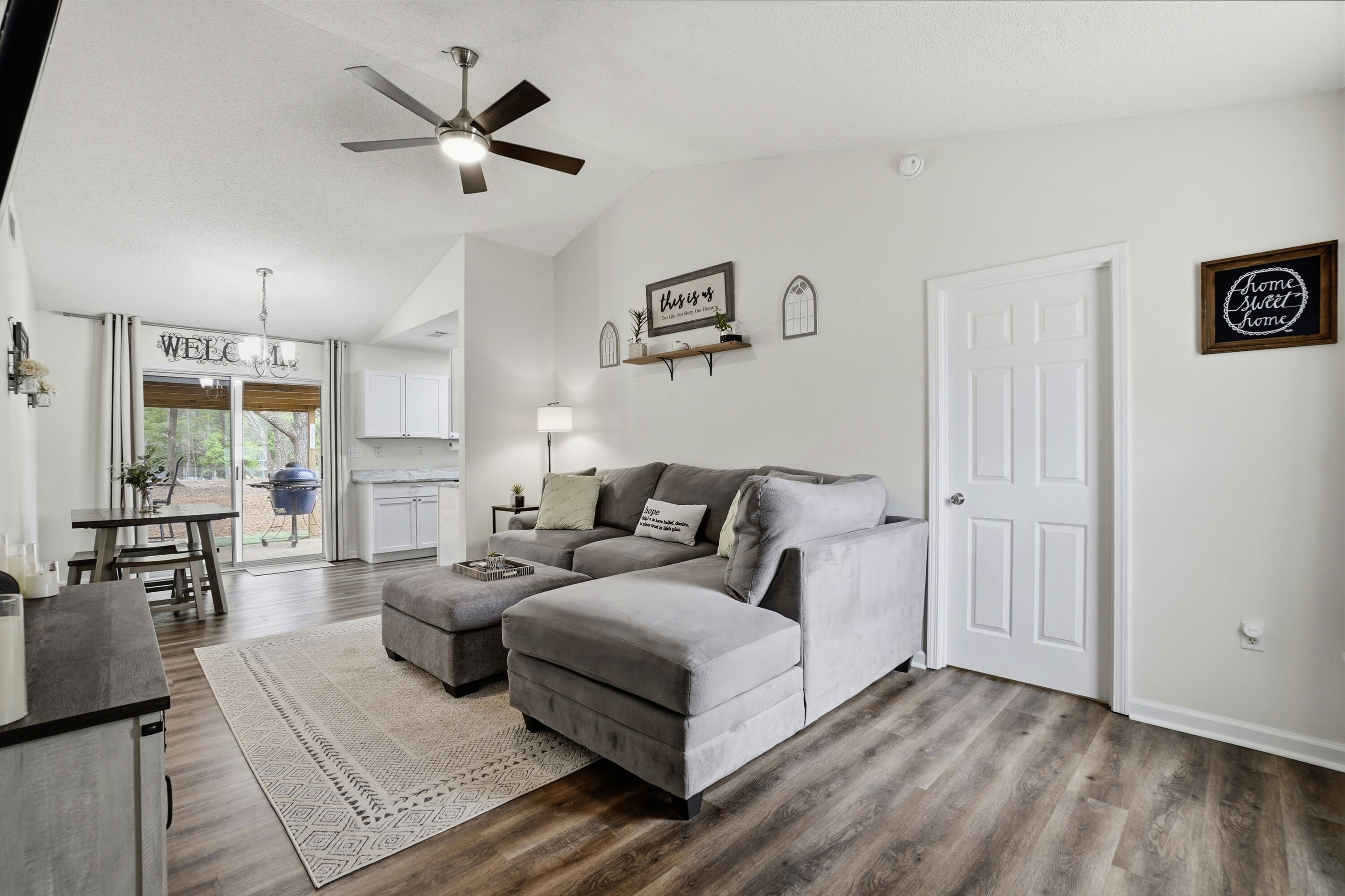 91 Oakridge Way DeFuniak Springs, FL 32433 - Photo 2 of 25 a living room with furniture a large window and a table