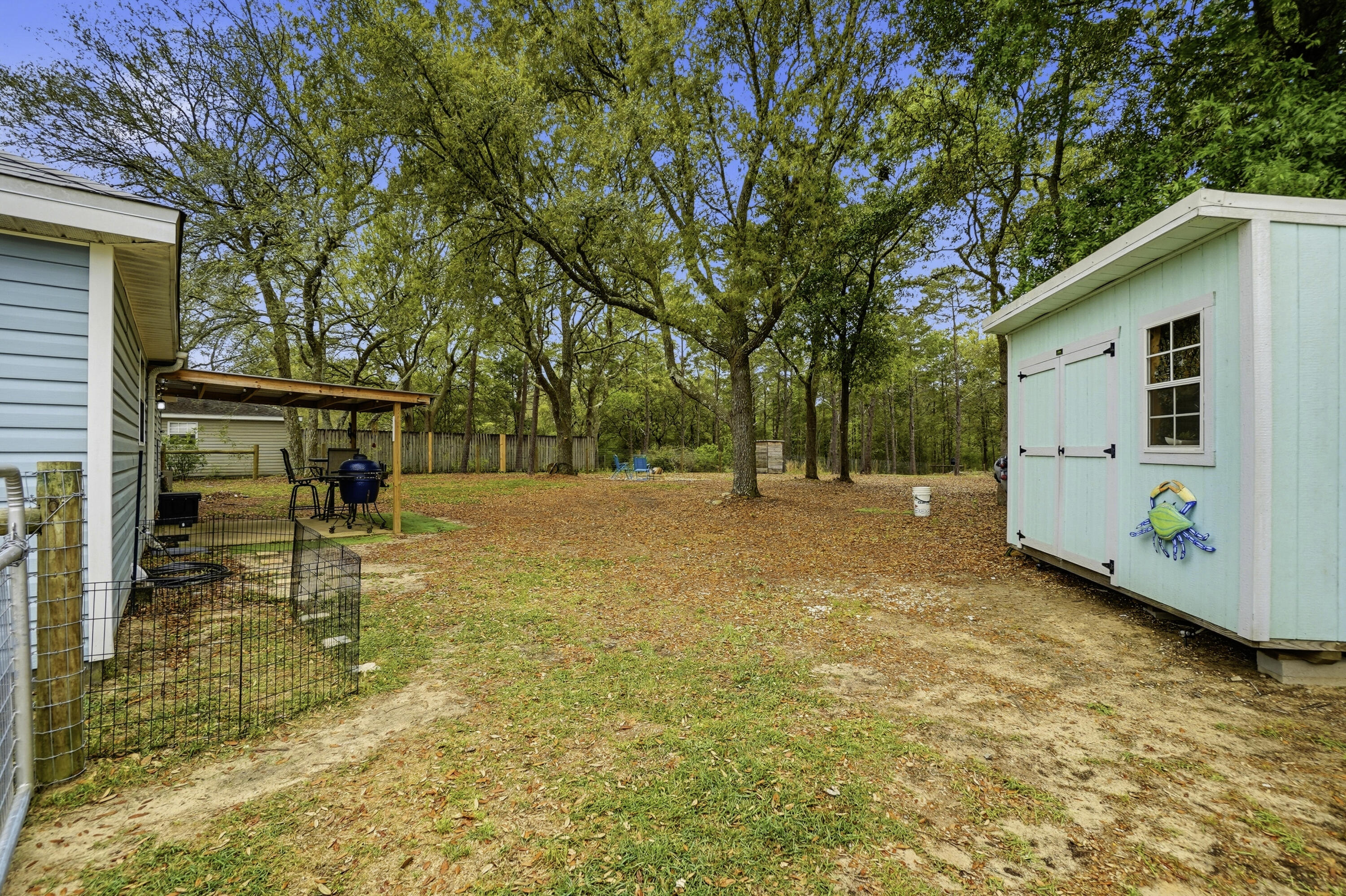 91 Oakridge Way DeFuniak Springs, FL 32433 - Photo 21 of 25 a view of a house with backyard and a tree