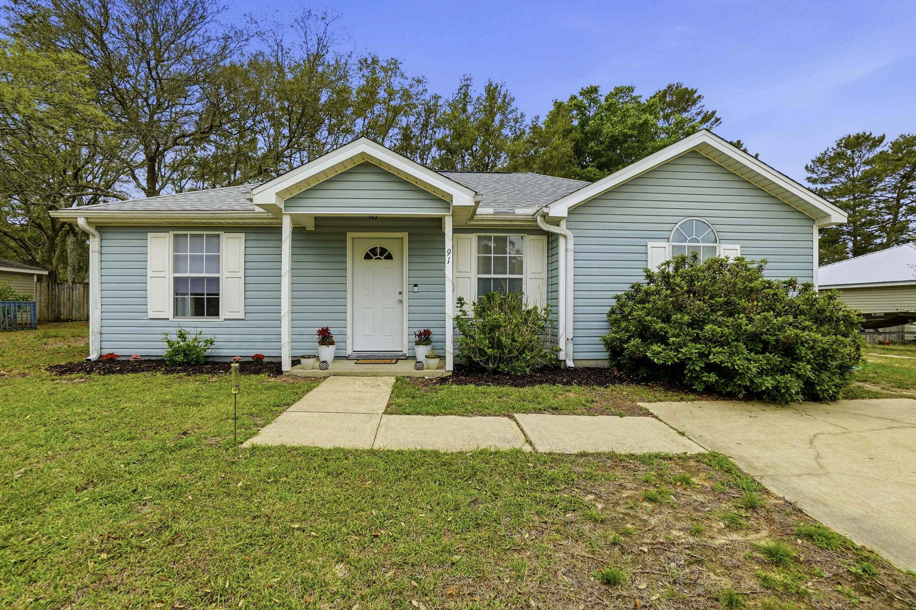91 Oakridge Way DeFuniak Springs, FL 32433 - Photo 25 of 25 a view of a house with yard and plants