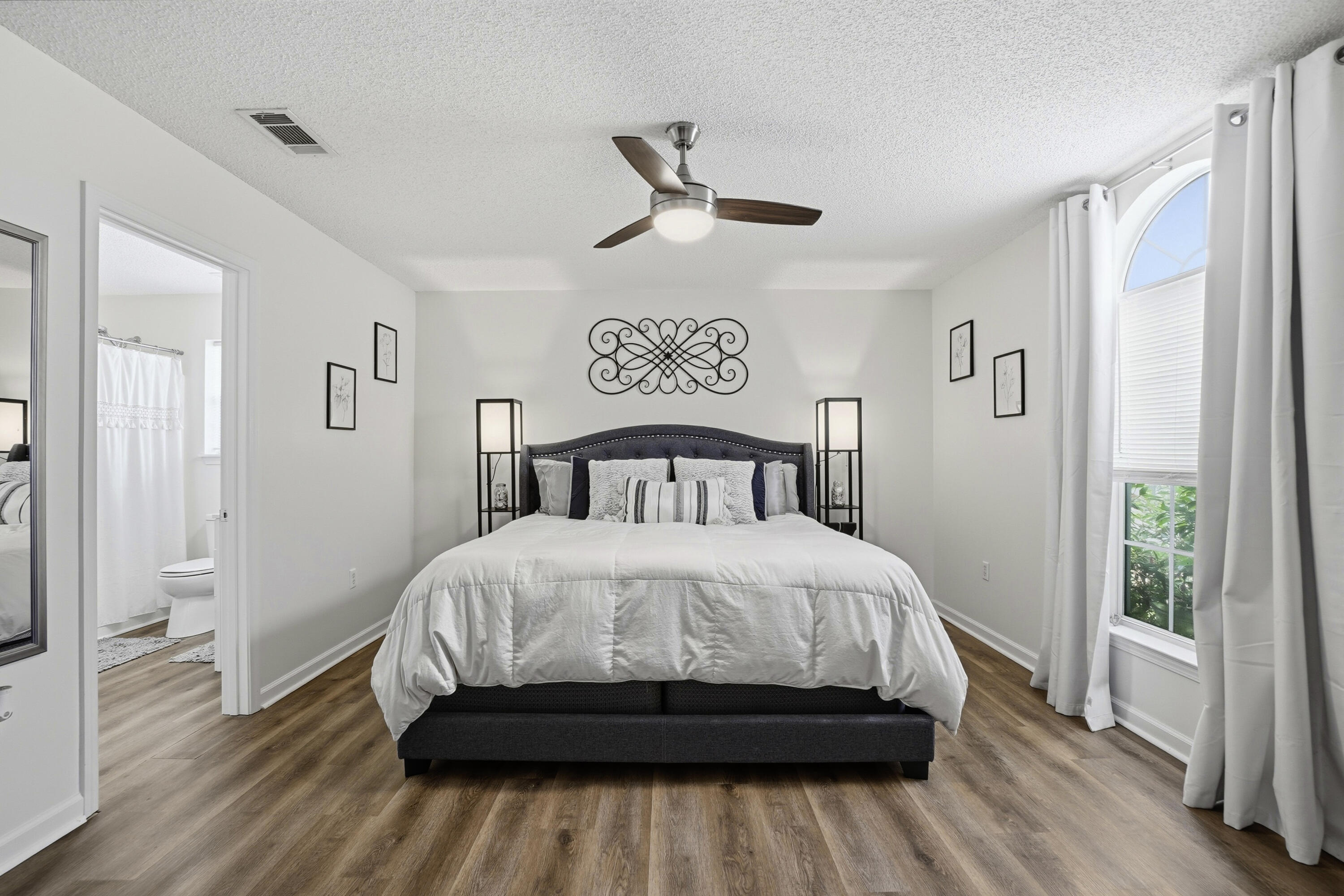 91 Oakridge Way DeFuniak Springs, FL 32433 - Photo 10 of 25 a bedroom with a bed and wooden floor