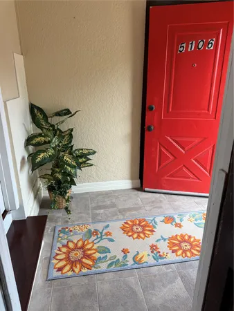a view of a door with a bench