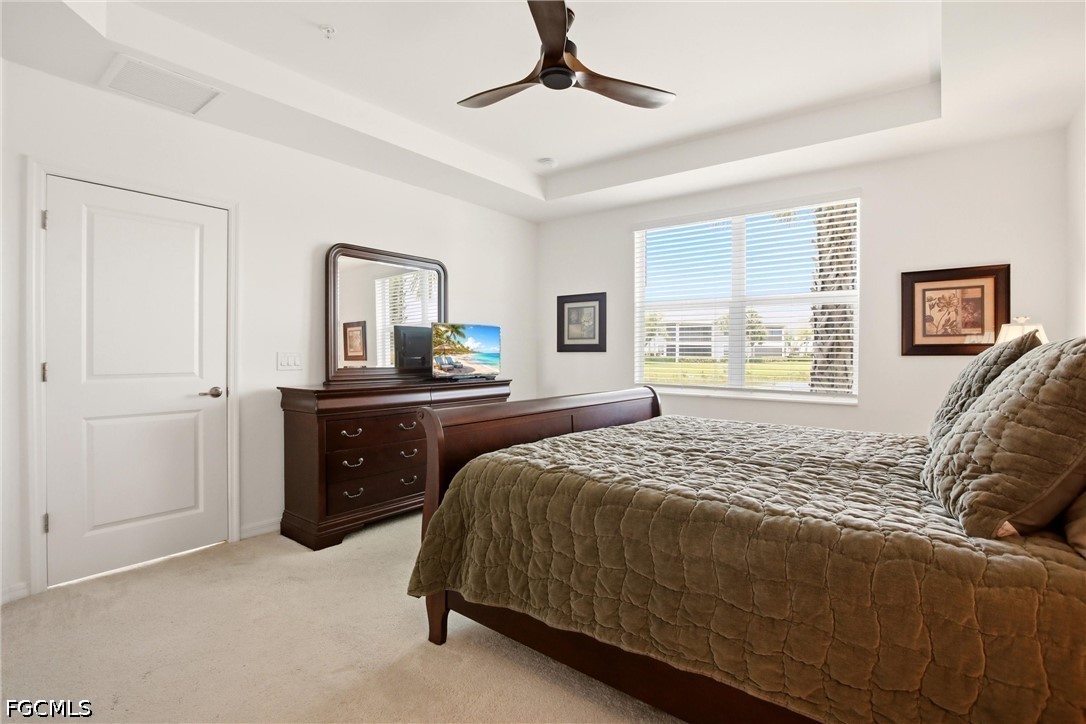 3751 Pebblebrook Ridge Court, Unit 101 Fort Myers, FL 33905 - Photo 20 of 48 a bedroom with a bed and a dresser