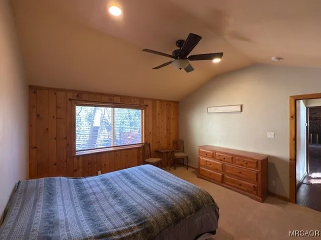 a view of walk in closet with wooden floor
