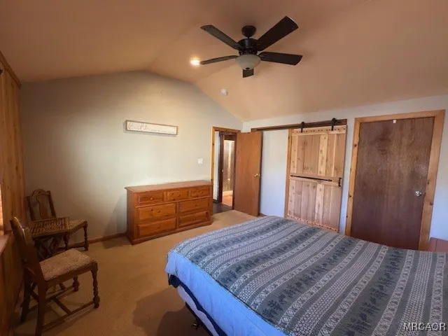 a room with a workbench and a window