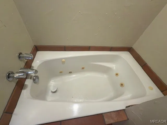 a bathroom with a toilet a sink and shower