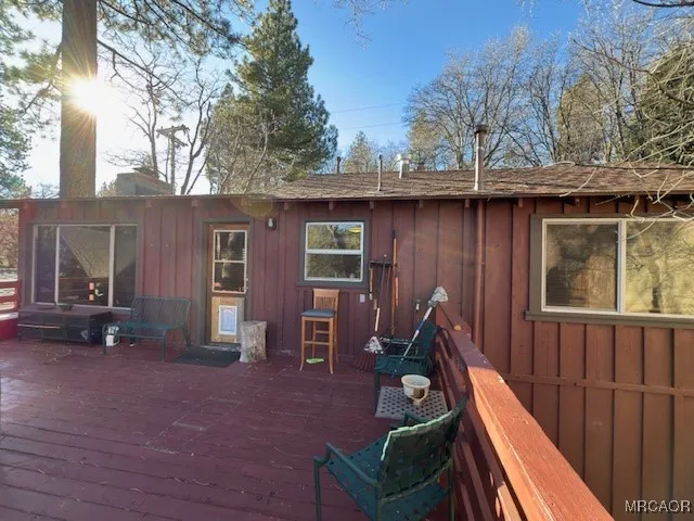 a view of backyard with seating space and trees