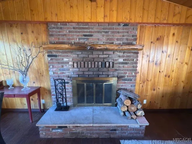 a living room with lots of furniture and hard wood flooring
