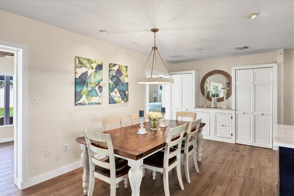 2149 Wason Road Sarasota, FL 34231 - Photo 13 of 32 a view of a dining room with furniture window and wooden floor