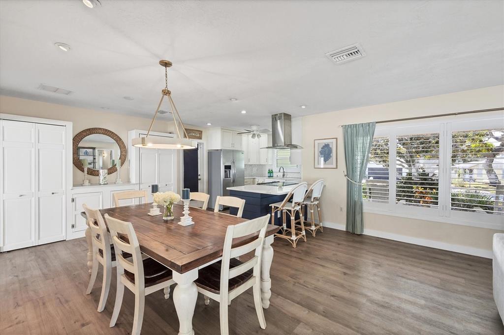 2149 Wason Road Sarasota, FL 34231 - Photo 14 of 32 a view of a dining room with furniture window and wooden floor