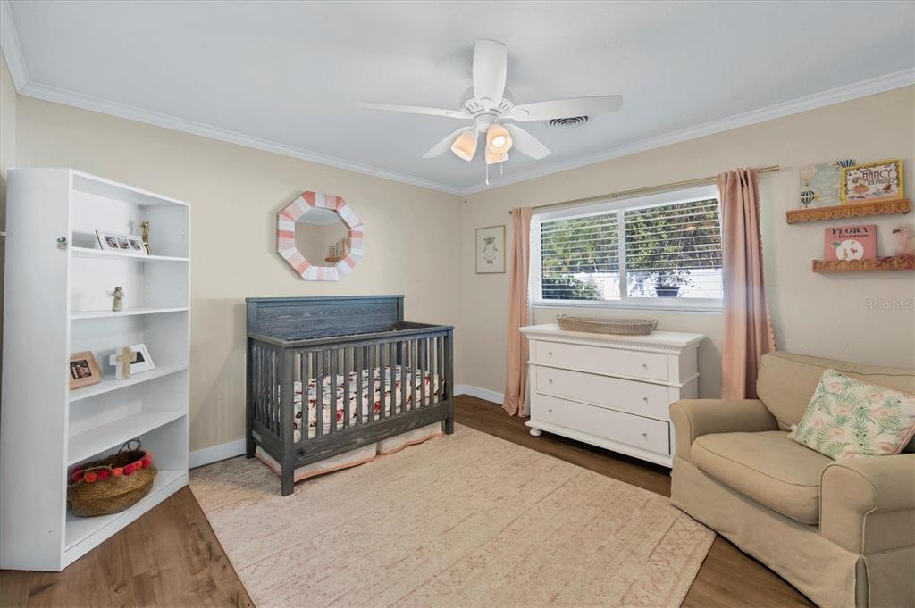2149 Wason Road Sarasota, FL 34231 - Photo 22 of 32 a bedroom with furniture and a window