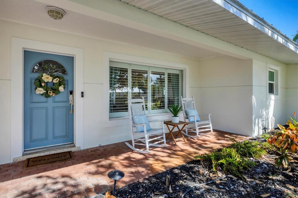2149 Wason Road Sarasota, FL 34231 - Photo 4 of 32 a view of a porch with chairs and backyard