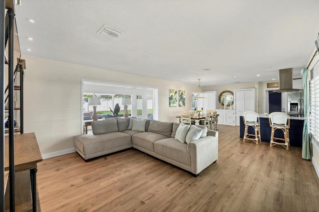2149 Wason Road Sarasota, FL 34231 - Photo 7 of 32 a living room with furniture and a wooden floor