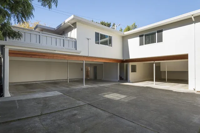 a view of a house with a parking space