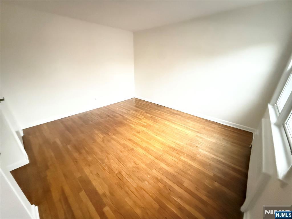 293 Bogert Road, Unit 1A River Edge, NJ 07661 - Photo 12 of 14 a view of a big room with wooden floor