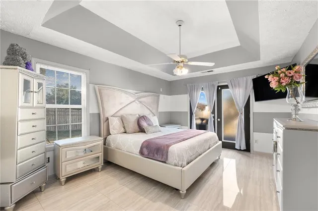 a spacious bathroom with a shower sink and mirror