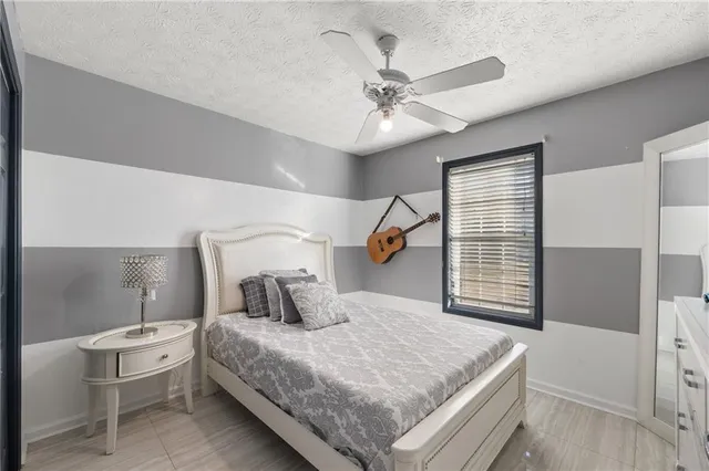 a view of a roof deck with table and chairs with wooden floor and fence