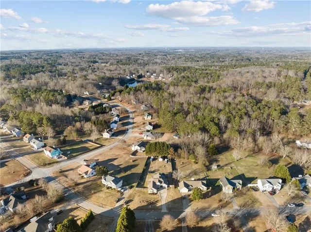 an aerial view of residential building and parking space