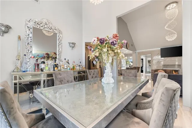 a large kitchen with a table and chairs