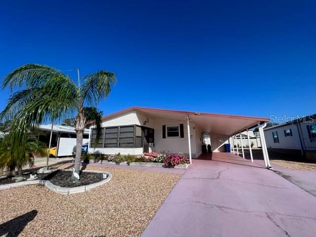 a view of a house with outdoor space and sitting area
