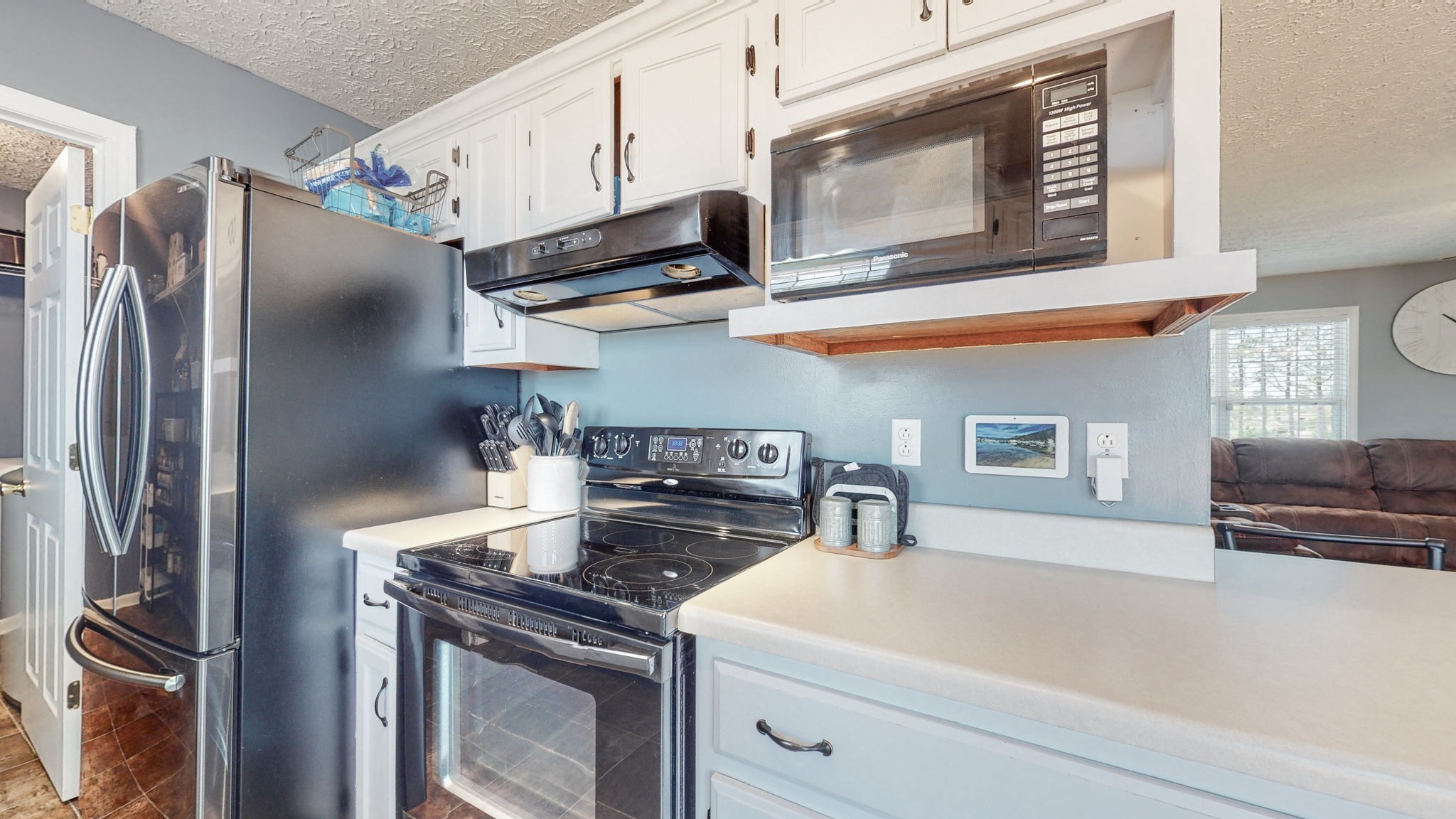 4321 Matthews Road Cedar Hill, TN 37032 - Photo 17 of 29 a kitchen with stainless steel appliances granite countertop a stove and a refrigerator