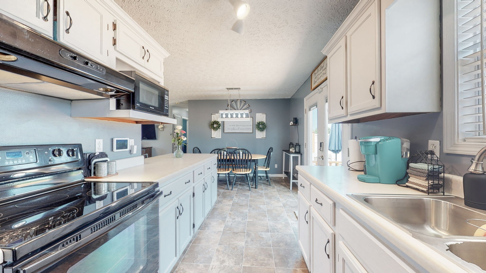 4321 Matthews Road Cedar Hill, TN 37032 - Photo 18 of 29 a large kitchen with cabinets