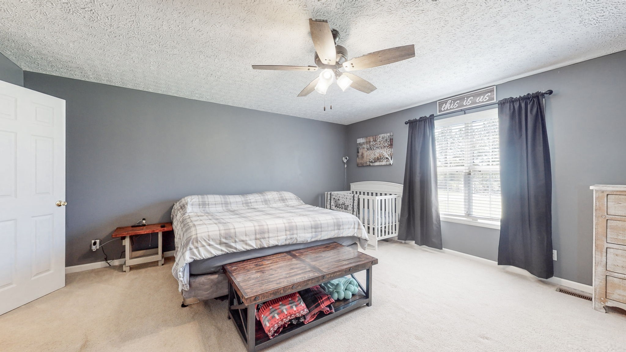4321 Matthews Road Cedar Hill, TN 37032 - Photo 21 of 29 a bedroom with a bed and a chandelier
