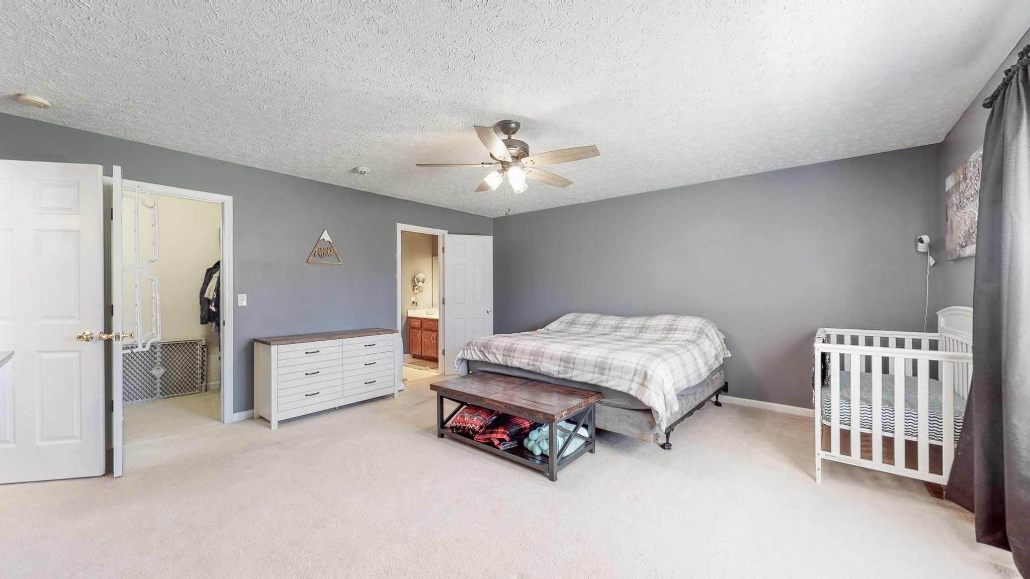 4321 Matthews Road Cedar Hill, TN 37032 - Photo 22 of 29 a bedroom with a bed and a chandelier