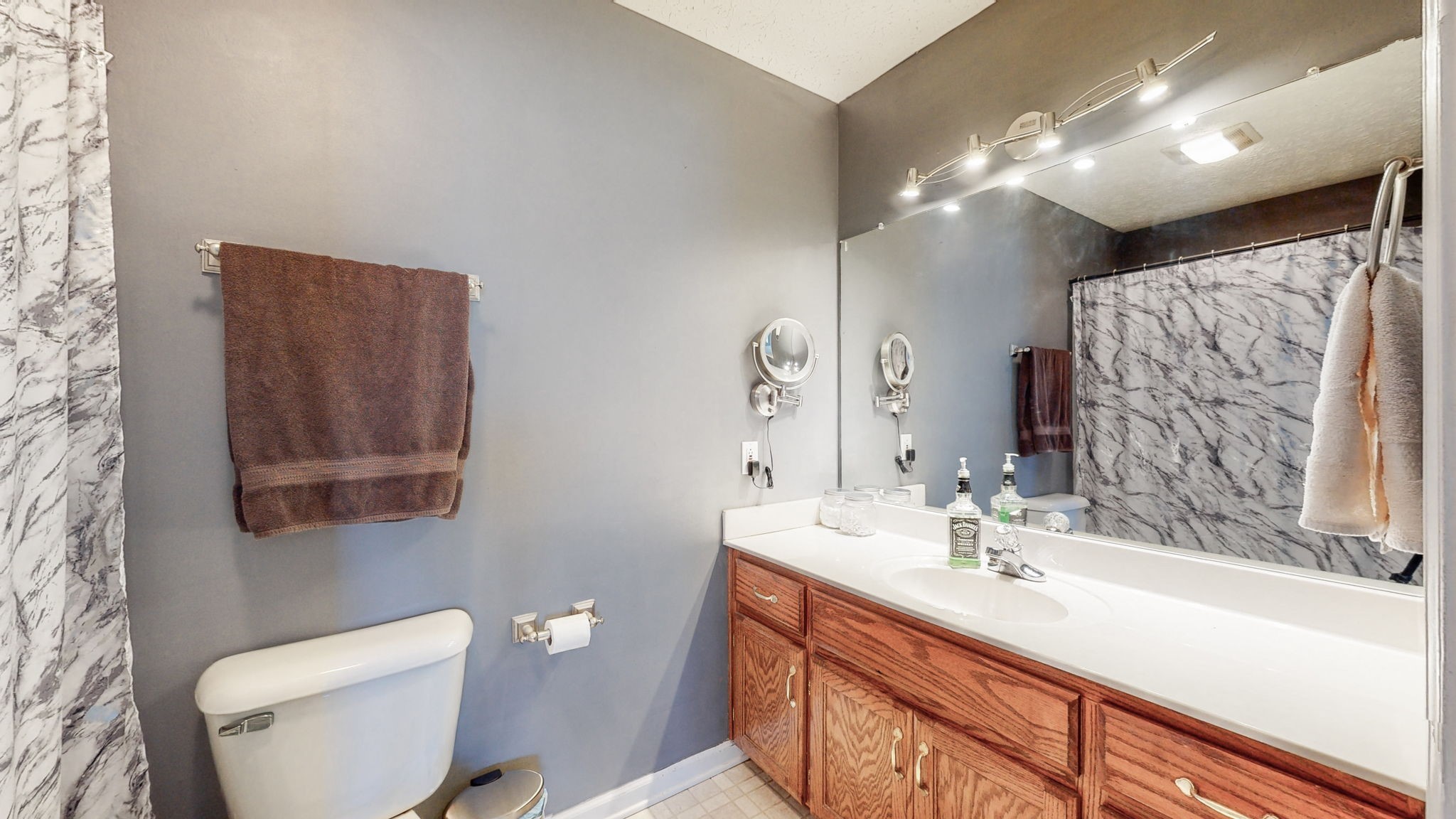 4321 Matthews Road Cedar Hill, TN 37032 - Photo 23 of 29 a bathroom with a sink a light fixture and a toilet