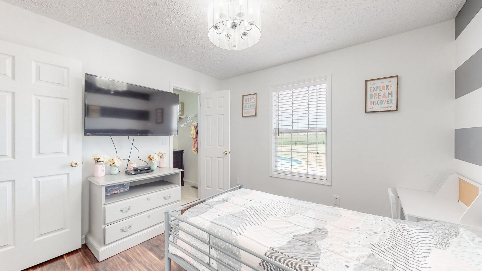 4321 Matthews Road Cedar Hill, TN 37032 - Photo 25 of 29 a bedroom with a bed and a flat screen tv