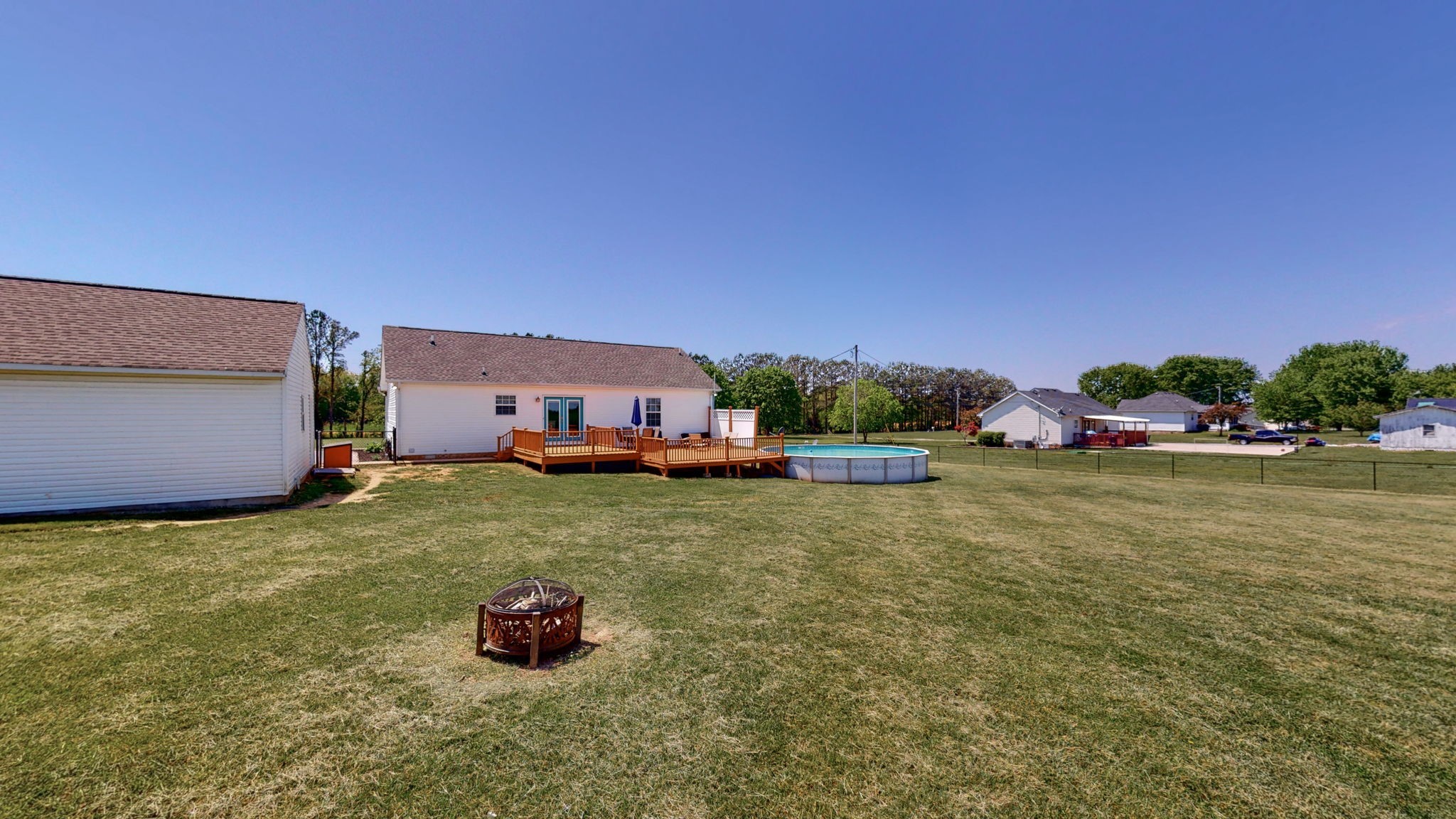 4321 Matthews Road Cedar Hill, TN 37032 - Photo 29 of 29 a backyard of a house with lots of green space and fountain