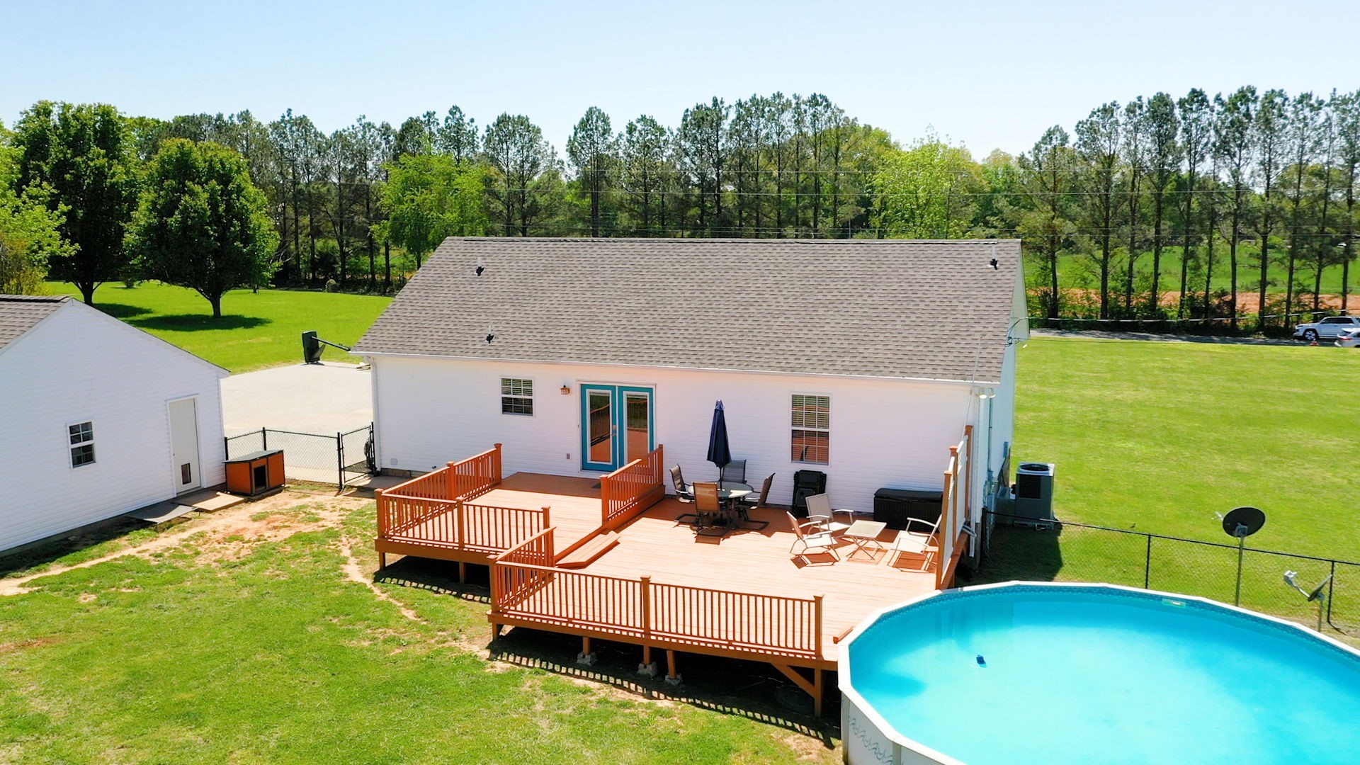 4321 Matthews Road Cedar Hill, TN 37032 - Photo 9 of 29 a view of a house with backyard patio and swimming pool