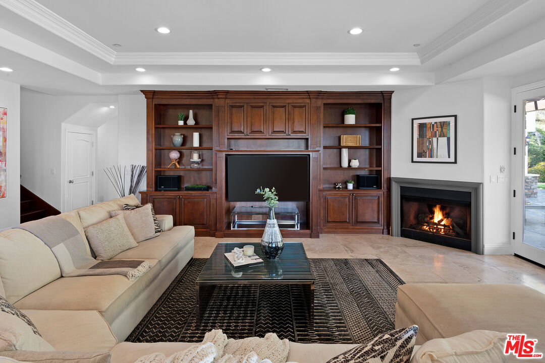 23575 Parksouth Street Calabasas, CA 91302 - Photo 16 of 75 a living room with furniture and a fireplace