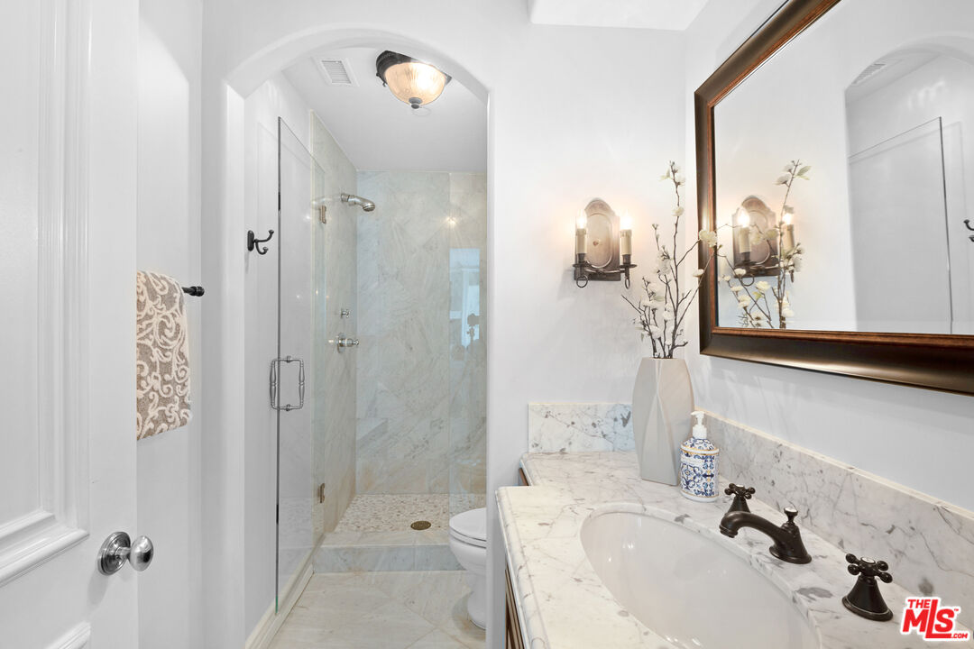 23575 Parksouth Street Calabasas, CA 91302 - Photo 32 of 75 a bathroom with a sink and mirror