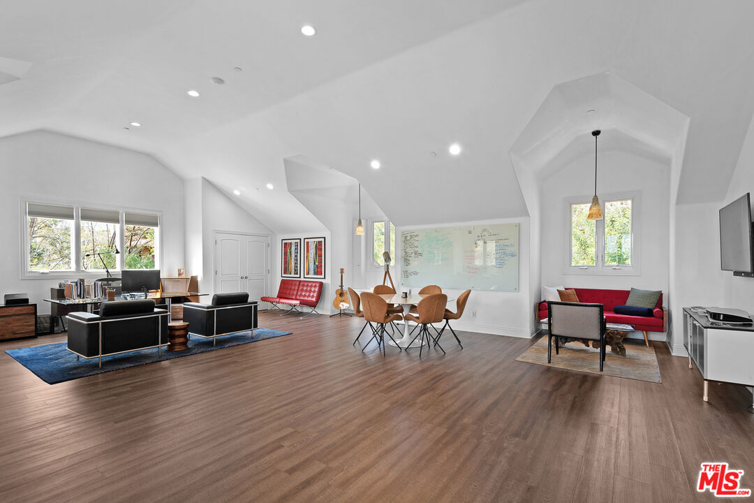 23575 Parksouth Street Calabasas, CA 91302 - Photo 36 of 75 a living room with furniture window and wooden floor