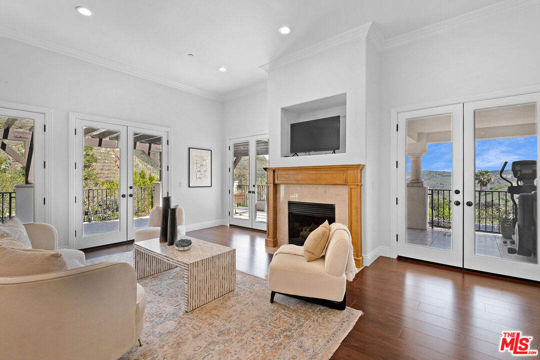 23575 Parksouth Street Calabasas, CA 91302 - Photo 46 of 75 a living room with furniture and a fireplace