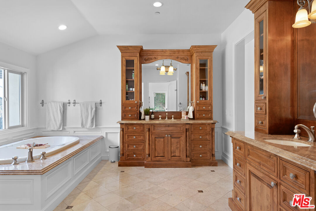 23575 Parksouth Street Calabasas, CA 91302 - Photo 50 of 75 a large spacious bathroom with a tub sink and mirror