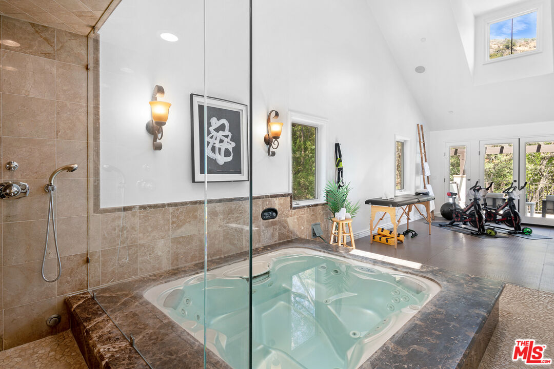23575 Parksouth Street Calabasas, CA 91302 - Photo 53 of 75 a bathroom with a tub sink and mirror